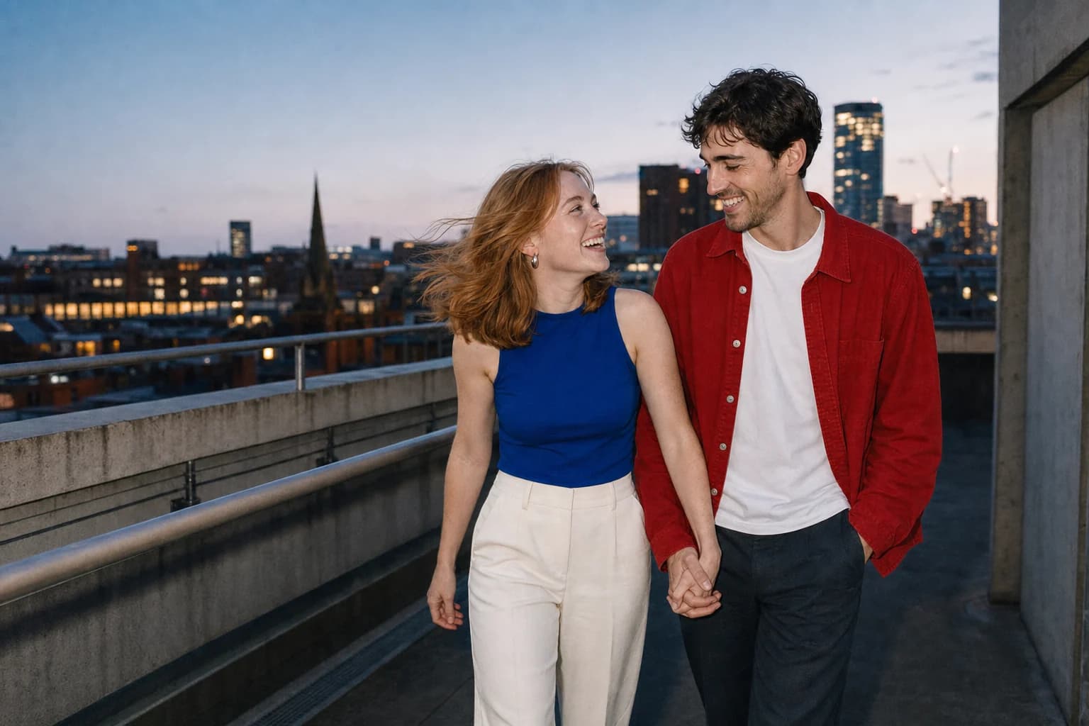 Phoebe and Max walking across a Birmingham rooftop at dusk